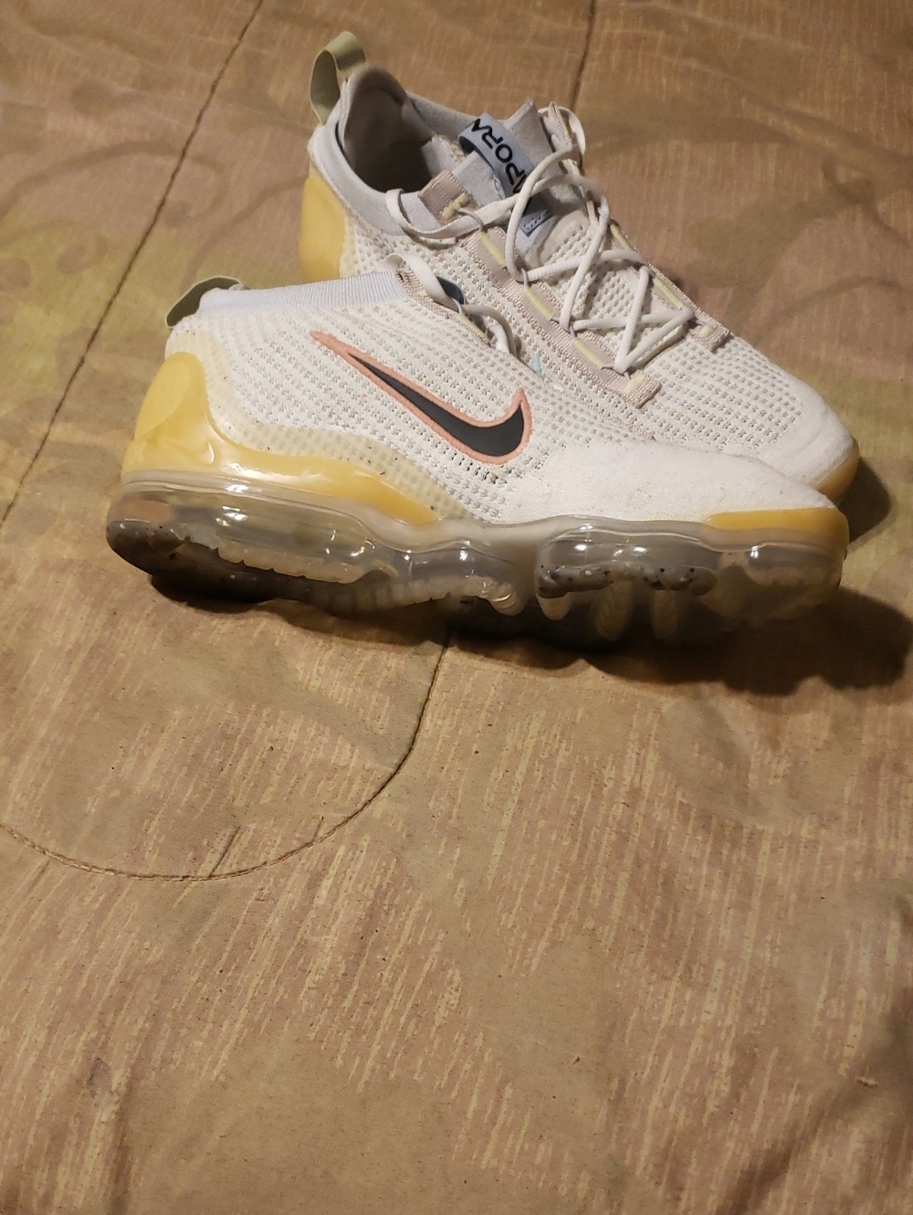 Nike White Knit Sneakers with Yellow Accents and Black Swoosh